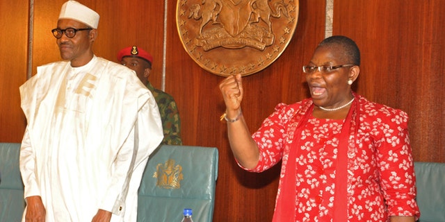 July 8, 2015: Nigerian President Muhammadu Buhari, left, stands next to Oby Ezekwesili, a coordinator of the 'Bring Back Our Girls' campaign that was started after Nigerian extremists abducted girls from a Nigerian school, at the presidential residence in Abuja, Nigeria.