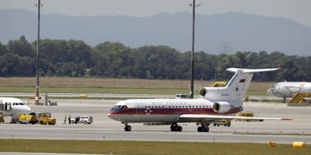 July 9: A Russian plane believed to be carrying candidates for a 14-person spy swap as part of the largest spy swap since the Cold War is parked on the tarmac at Vienna's Schwechat airport (AP).