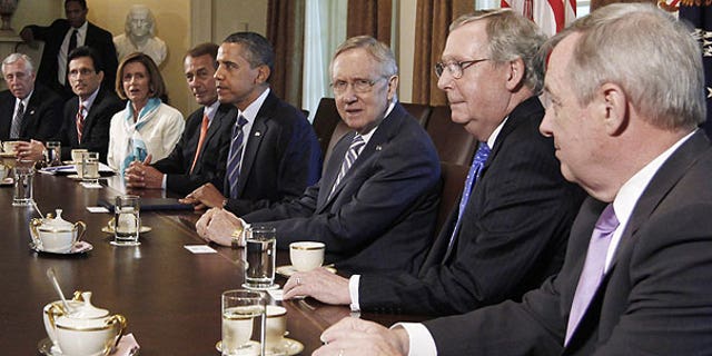 July 7: President Barack Obama meets with the Congressional leadership in the Cabinet Room of the White House in Washington, to discuss the debt. From left are, House Minority Whip Steny Hoyer of Md., House Majority Leader Eric Cantor of Va., House Minority Leader Nancy Pelosi of Calif., House Speaker John Boehner of Ohio, the president, Senate Majority Leader Harry Reid of Nev., Senate Minority Leader Mitch McConnell of Ky., and Senate Majority Whip Richard Durbin of Ill.