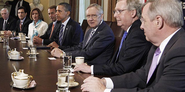 July 7: President Barack Obama meets with the Congressional leadership in the Cabinet Room of the White House in Washington, to discuss the debt. From left are, House Minority Whip Steny Hoyer of Md., House Majority Leader Eric Cantor of Va., House Minority Leader Nancy Pelosi of Calif., House Speaker John Boehner of Ohio, the president, Senate Majority Leader Harry Reid of Nev., Senate Minority Leader Mitch McConnell of Ky., and Senate Majority Whip Richard Durbin of Ill.