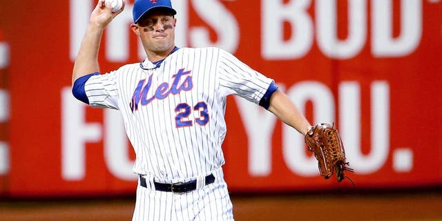 NEW YORK, NY - JUNE 30: Michael Cuddyer #23 of the New York Mets fields the ball in the third inning against the Chicago Cubs on June 30, 2015 at Citi Field in the Flushing Neighborhood of the Queens borough of New York City. (Photo by Nate Shron/Getty Images)