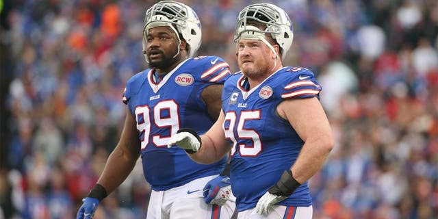 ORCHARD PARK, NY - NOVEMBER 30: Kyle Williams #95 of the Buffalo Bills and Marcell Dareus #99 look on during NFL game action against the Cleveland Browns at Ralph Wilson Stadium on November 30, 2014 in Orchard Park, New York. (Photo by Tom Szczerbowski/Getty Images)