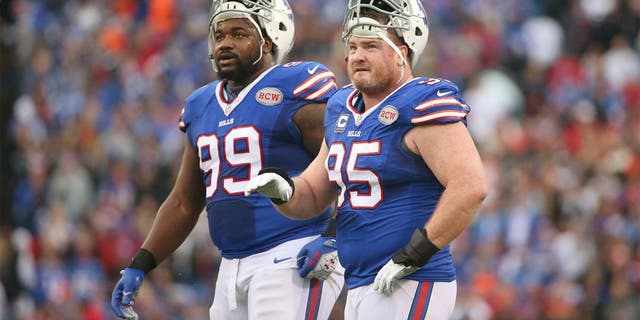 ORCHARD PARK, NY - NOVEMBER 30: Kyle Williams #95 of the Buffalo Bills and Marcell Dareus #99 look on during NFL game action against the Cleveland Browns at Ralph Wilson Stadium on November 30, 2014 in Orchard Park, New York. (Photo by Tom Szczerbowski/Getty Images)