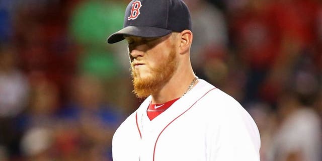 > at Fenway Park on July 5, 2016 in Boston, Massachusetts.,BOSTON, MA - JULY 05: Craig Kimbrel #46 of the Boston Red Sox walks off the field in the ninth inning after giving up a three-run home run to Robinson Chirinos #61 of the Texas Rangers at Fenway Park on July 5, 2016 in Boston, Massachusetts. (Photo by Adam Glanzman/Getty Images)