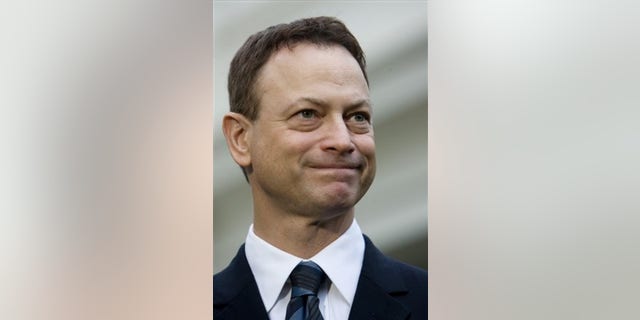 Actor Gary Sinise, a recipient of the 2008 Presidential Citizens Medal from George W. Bush, spoke to members of the press on Wednesday, Dec. 10, 2008, outside the White House in Washington.