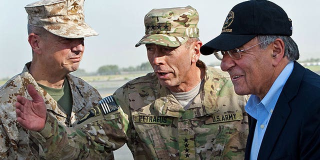 July 9: USMC Gen. John Allen, left, and Army Gen. David Petraeus, top U.S. commander in Afghanistan and incoming CIA Director, greet former CIA Director and new U.S. Defense Secretary Leon Panetta, right, as he lands in Kabul, Afghanistan.
