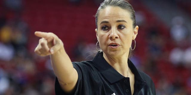 Becky Hammon coaches the San Antonio Spurs during an NBA summer league basketball game against the New York Knicks on Saturday, July 11, 2015, in Las Vegas. (AP Photo/Ronda Churchill)