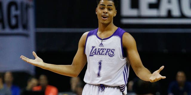 Los Angeles Lakersâ D'Angelo Russell reacts after scoring against the Minnesota Timberwolves during the first half of their NBA summer league basketball game Friday, July 10, 2015, in Las Vegas. (AP Photo/John Locher)