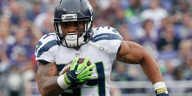 at M&T Bank Stadium on December 13, 2015 in Baltimore, Maryland.,BALTIMORE, MD - DECEMBER 13: Running back Thomas Rawls #34 of the Seattle Seahawks carries the ball in the first half against the Baltimore Ravens at M&T Bank Stadium on December 13, 2015 in Baltimore, Maryland. (Photo by Rob Carr/Getty Images)