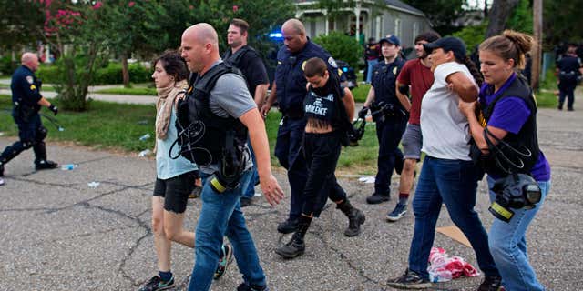 July 10, 2016: Police arrest protesters in a residential neighborhood in Baton Rouge, La.
