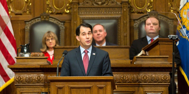 Jan. 13, 2015: Wisconsin Gov. Scott Walker, center, addresses a joint session of the state Legislature during the Governor's State of the State speech in the Assembly chambers at the state Capitol in Madison, Wis.