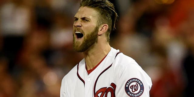 WASHINGTON, DC - AUGUST 05: Bryce Harper #34 of the Washington Nationals reacts after flying out in the sixth inning against the New York Mets at Nationals Park on August 5, 2014 in Washington, DC. The New York Mets won, 6-1. (Photo by Patrick Smith/Getty Images)