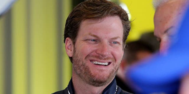 SPARTA, KY - JULY 07: Dale Earnhardt Jr., driver of the #88 Nationwide Chevrolet, stands in the garage area during practice for the NASCAR Sprint Cup Series Quaker State 400 at Kentucky Speedway on July 7, 2016 in Sparta, Kentucky. (Photo by Jerry Markland/Getty Images)
