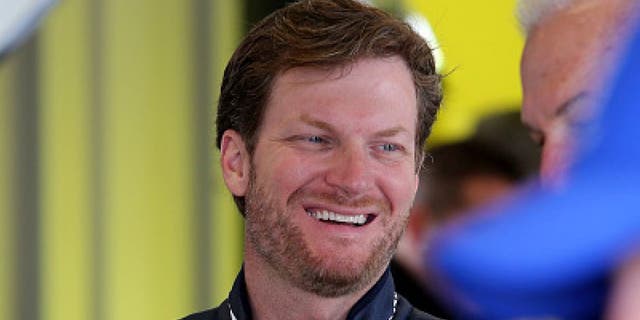 SPARTA, KY - JULY 07: Dale Earnhardt Jr., driver of the #88 Nationwide Chevrolet, stands in the garage area during practice for the NASCAR Sprint Cup Series Quaker State 400 at Kentucky Speedway on July 7, 2016 in Sparta, Kentucky. (Photo by Jerry Markland/Getty Images)