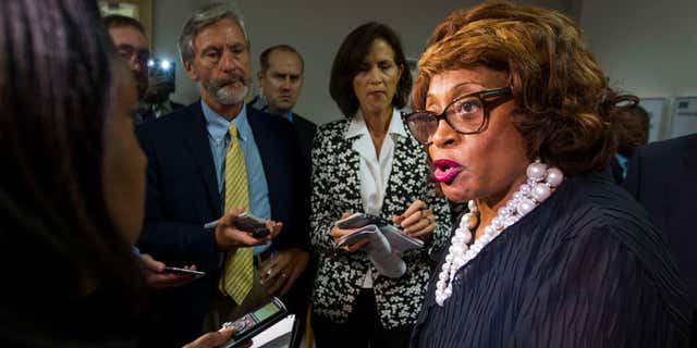 FILE - In this Aug. 13, 2015 file photo, Rep. Corrine Brown, D-Fla. talks with the press in Tallahassee, Fla.