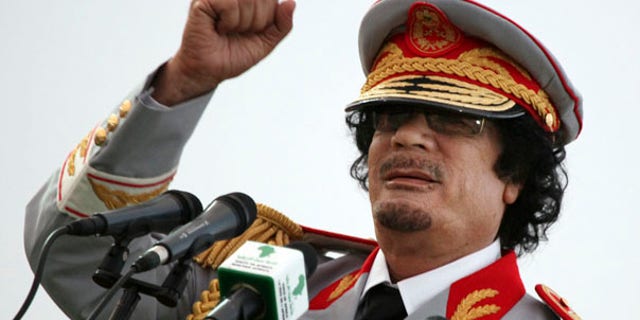 June 12: Libyan leader Muammar Qaddafi speaks during a ceremony in Tripoli.