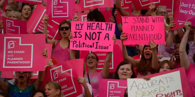 FILE - This Aug. 25, 2015, file photo, Planned Parenthood Action Council holds a community rally at the state Capitol, in Salt Lake City.