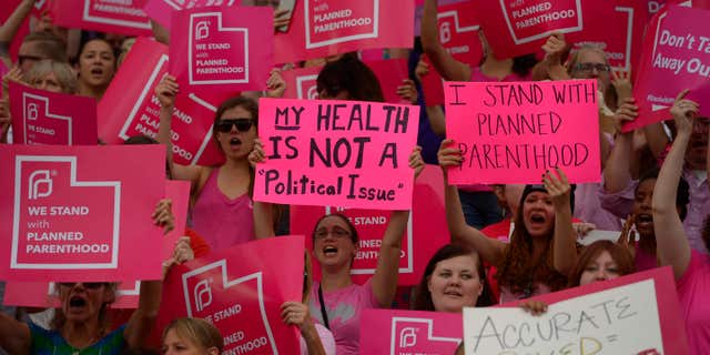 FILE - This Aug. 25, 2015, file photo, Planned Parenthood Action Council holds a community rally at the state Capitol, in Salt Lake City.