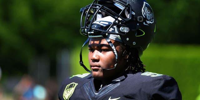 Jul 10, 2014; Beaverton, OR, USA; Defensive lineman Rashan Gary (97) looks on from the sidelines during Nike Football ' The Opening' at Nike World Headquarters. Mandatory Credit: Steve Dykes-USA TODAY Sports