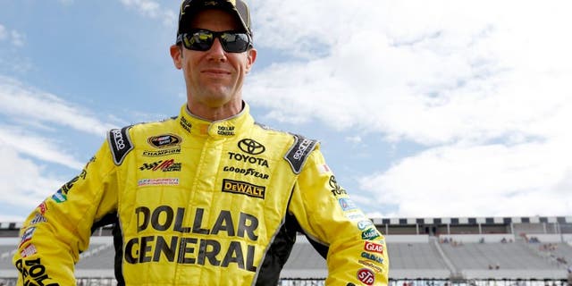 LONG POND, PA - JUNE 05: Matt Kenseth, driver of the #20 Dollar General Toyota, stands on the grid during qualifying for the NASCAR Sprint Cup Series Axalta "We Paint Winners" 400 at Pocono Raceway on June 5, 2015 in Long Pond, Pennsylvania. (Photo by Todd Warshaw/NASCAR via Getty Images)
