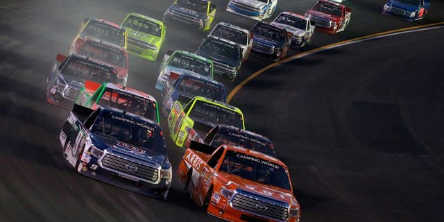 SPARTA, KY - JULY 07: Daniel Suarez, driver of the #51 ARRIS Toyota, and William Byron, driver of the #9 Liberty University Toyota, lead the field in a restart during the NASCAR Camping World Truck Series Buckle Up In Your Truck 225 at Kentucky Speedway on July 7, 2016 in Sparta, Kentucky. (Photo by Matt Sullivan/Getty Images)