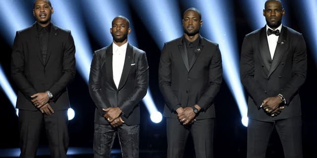 NBA basketball players Carmelo Anthony, from left, Chris Paul, Dwyane Wade and LeBron James speak on stage at the ESPY Awards at the Microsoft Theater on Wednesday, July 13, 2016, in Los Angeles. (Photo by Chris Pizzello/Invision/AP)