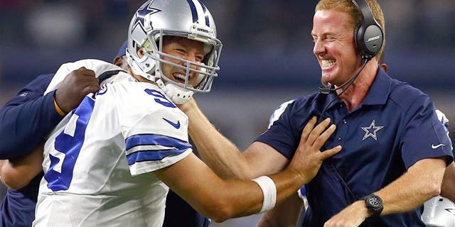 ARLINGTON, TX - SEPTEMBER 13: Tony Romo #9 of the Dallas Cowboys celebrates with head coach Jason Garrett of the Dallas Cowboys after scoring the game winning touchdown against the New York Giants at AT&T Stadium on September 13, 2015 in Arlington, Texas. (Photo by Tom Pennington/Getty Images)
