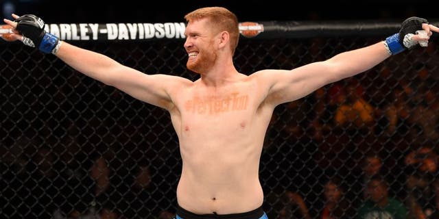 ADELAIDE, AUSTRALIA - MAY 10: Sam Alvey celebrates his knock out victory over Daniel Kelly in their middleweight bout during the UFC Fight Night event at the Adelaide Entertainment Centre on May 10, 2015 in Adelaide, Australia. (Photo by Josh Hedges/Zuffa LLC/Zuffa LLC via Getty Images)