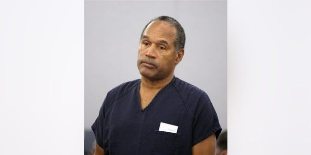 In this Dec. 5, 2008 file photo, O.J. Simpson stands in court during his sentencing hearing at the Clark County Regional Justice Center in Las Vegas.