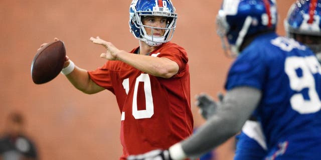 Jun 16, 2015; East Rutherford, NJ, USA; New York Giants quarterback Eli Manning (10) drops back to pass during minicamp at Quest Diagnostics Training Center. Mandatory Credit: Steven Ryan-USA TODAY Sports