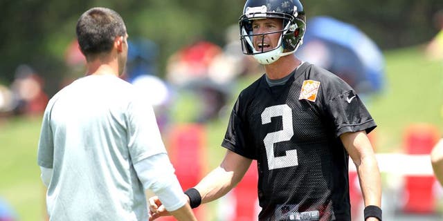 Jun 17, 2015; Atlanta, GA, USA; Atlanta Falcons quarterback Matt Ryan (2) talks to offensive coordinator Kyle Shanahan during minicamp at Falcons Training Facility. Mandatory Credit: Brett Davis-USA TODAY Sports