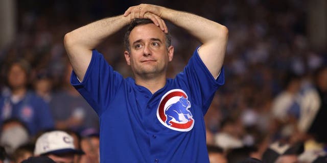 CHICAGO - OCTOBER 06: A fan of the Chicago Cubs looks on dejected against the Arizona Diamondbacks during Game Three of the National League Divisional Series at Wrigley Field on October 6, 2007 in Chicago, Illinois. (Photo by Jamie Squire/Getty Images)