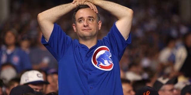 CHICAGO - OCTOBER 06: A fan of the Chicago Cubs looks on dejected against the Arizona Diamondbacks during Game Three of the National League Divisional Series at Wrigley Field on October 6, 2007 in Chicago, Illinois. (Photo by Jamie Squire/Getty Images)