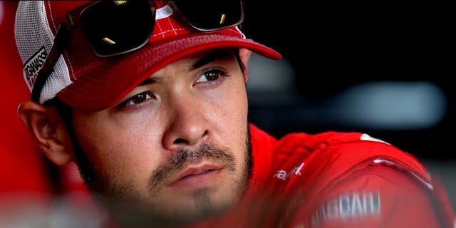 SPARTA, KY - JULY 08: Kyle Larson, driver of the #42 Target Chevrolet, stands in the garage area during practice for the NASCAR Sprint Cup Series Quaker State 400 at Kentucky Speedway on July 8, 2016 in Sparta, Kentucky. (Photo by Jerry Markland/Getty Images)