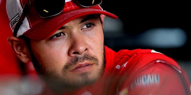 SPARTA, KY - JULY 08: Kyle Larson, driver of the #42 Target Chevrolet, stands in the garage area during practice for the NASCAR Sprint Cup Series Quaker State 400 at Kentucky Speedway on July 8, 2016 in Sparta, Kentucky. (Photo by Jerry Markland/Getty Images)