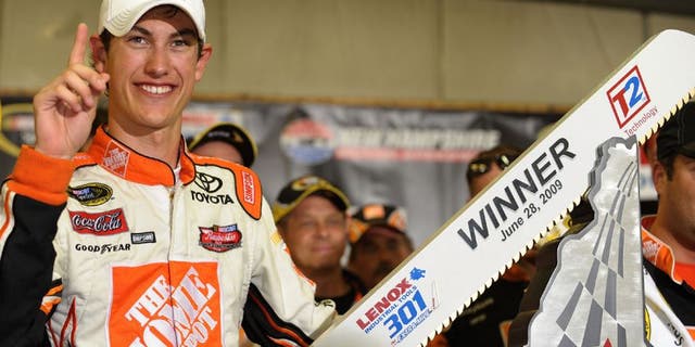 LOUDON, NH - JUNE 28: Joey Logano, driver of the #20 Home Depot Toyota, celebrates winning the NASCAR Sprint Cup Series LENOX Industrial Tools 301 at New Hampshire Motor Speedway on June 28, 2009 in Loudon, New Hampshire. Logano won the rain shortened race with 27 laps remaining. (Photo by Drew Hallowell/Getty Images for NASCAR)