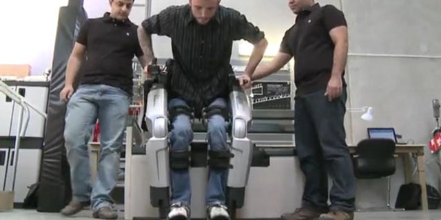Hayden Allen, who injured his spinal cord five years ago, tests out Rex, the robotic exoskeleton. "I'll never forget what it was like to see my feet walking under me the first time I used Rex," said Hayden.