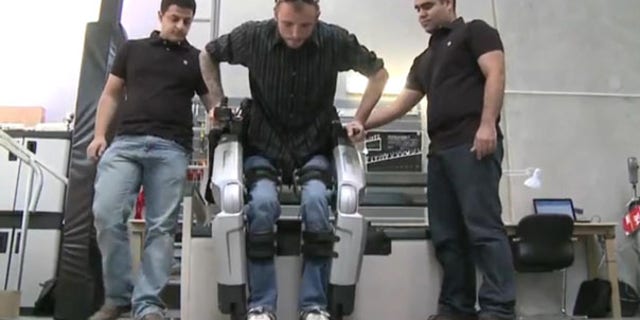 Hayden Allen, who injured his spinal cord five years ago, tests out Rex, the robotic exoskeleton. "I'll never forget what it was like to see my feet walking under me the first time I used Rex," said Hayden.