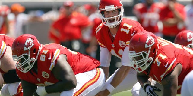 Sep 8, 2013; Jacksonville, FL, USA; Kansas City Chiefs quarterback Alex Smith (11) yells to the offensive line during the game against the Jacksonville Jaguars at EverBank Field. Mandatory Credit: Rob Foldy-USA TODAY Sports
