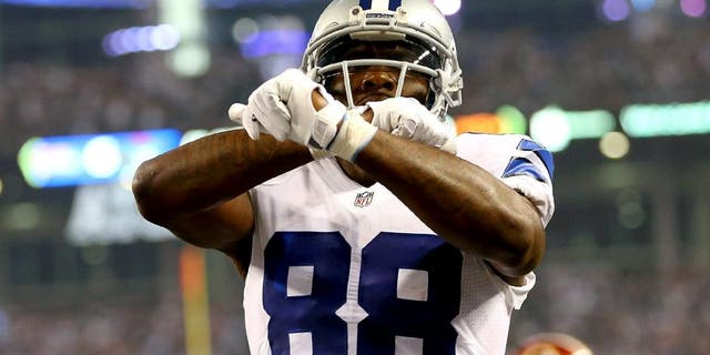 ARLINGTON, TX - OCTOBER 27: Dez Bryant #88 of the Dallas Cowboys celebrates his touchdown against the Washington Redskins during the first half at AT&T Stadium on October 27, 2014 in Arlington, Texas. (Photo by Ronald Martinez/Getty Images)