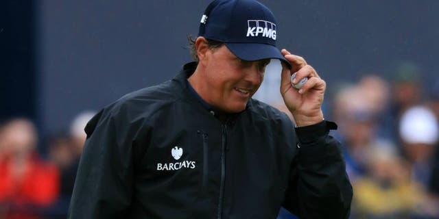 TROON, SCOTLAND - JULY 15: Phil Mickelson of the United States acknowledges the crowd after putting on the 18th green during the second round on day two of the 145th Open Championship at Royal Troon on July 15, 2016 in Troon, Scotland. (Photo by Matthew Lewis/Getty Images)