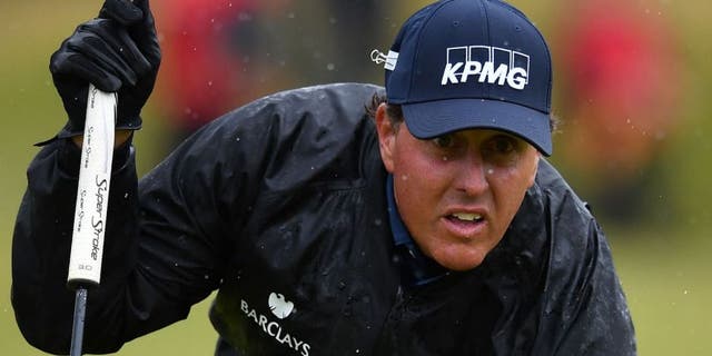 US golfer Phil Mickelson lines up a putt on the 13th green during his second round on day two of the 2016 British Open Golf Championship at Royal Troon in Scotland on July 15, 2016. The second round got underway on Friday morning, with expectations for far more trying conditions at Royal Troon. / AFP / Ben STANSALL / RESTRICTED TO EDITORIAL USE (Photo credit should read BEN STANSALL/AFP/Getty Images)