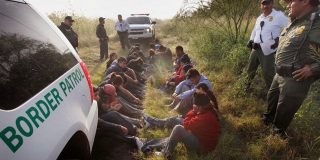 May 28: Border Patrol agents detain undocumented immigrants apprehended near McAllen, Texas.