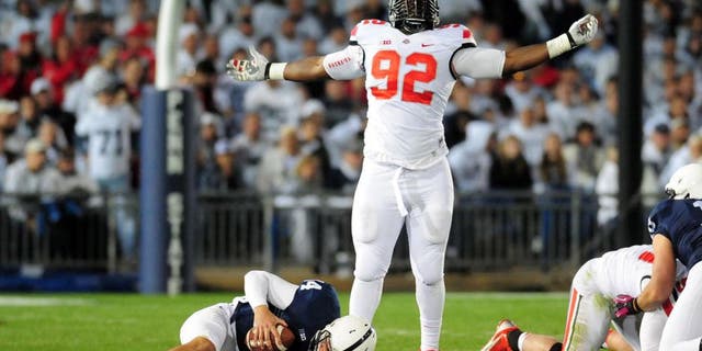 Oct 25, 2014; University Park, PA, USA; Ohio State Buckeyes defensive lineman Adolphus Washington (92) celebrates after sacking Penn State Nittany Lions quarterback Christian Hackenberg (14) in the fourth quarter at Beaver Stadium. Mandatory Credit: Evan Habeeb-USA TODAY Sports