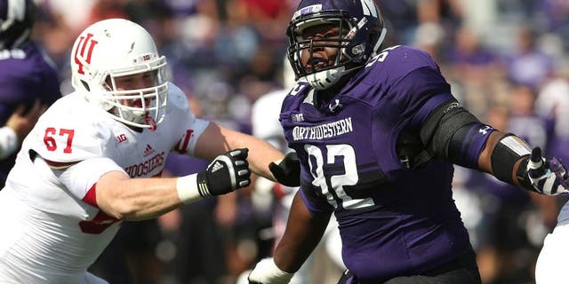 EVANSTON, IL - SEPTEMBER 29: Will Hampton #92 of the Northwestern Wildcats rushes against Dan Feeney #67 of the Indiana Hoosiers at Ryan Field on September 29, 2012 in Evanston, Illinois. Northwestern defeated Indiana 44-29. (Photo by Jonathan Daniel/Getty Images) *** Local Caption *** Will Hampton; Dan Feeney