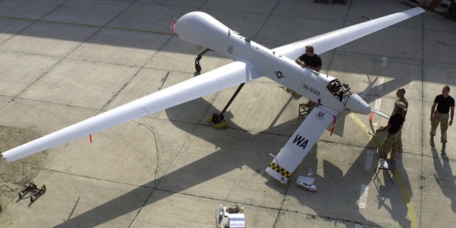 FILE: Members of the 11th Reconnaissance Squadron from Indian Springs, Nev., perform pre-flight checks on a Predator unmanned aerial vehicle prior to a mission.