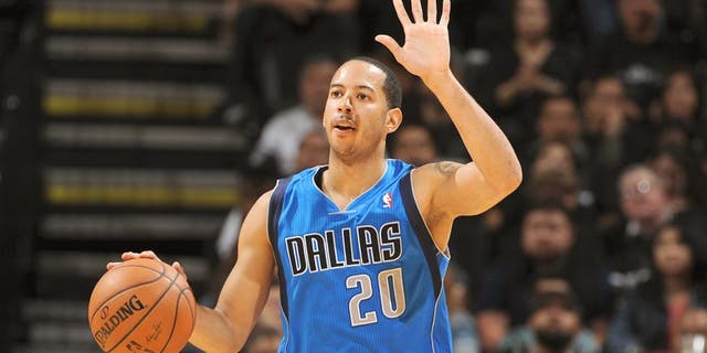 SAN ANTONIO, TX - APRIL 20: Devin Harris #20 of the Dallas Mavericks dribbles the ball during Game One of the Western Conference Quarterfinals during the 2014 NBA Playoffs against the San Antonio Spurs on April 20, 2014 at the AT&T Center in San Antonio, Texas. NOTE TO USER: User expressly acknowledges and agrees that, by downloading and/or using this Photograph, user is consenting to the terms and conditions of the Getty Images License Agreement. Mandatory Copyright Notice: Copyright 2013 NBAE (Photo by Garrett W. Ellwood/NBAE via Getty Images)
