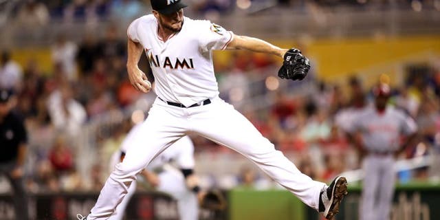 MIAMI, FL - JULY 09: Carter Capps #22 of the Miami Marlins in action during the game against the Cincinnati Reds at Marlins Park on July 9, 2015 in Miami, Florida. (Photo by Rob Foldy/Getty Images)