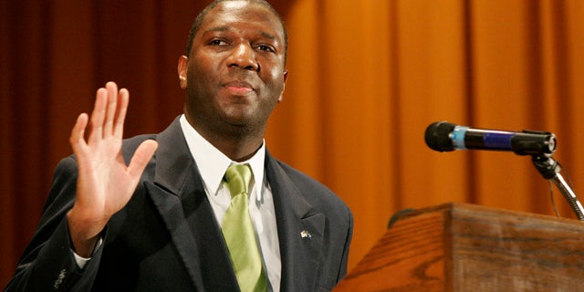 July 18: Alvin Greene, Democratic candidate for the U.S. Senate, waves after making his first public speech during the monthly meeting of the NAACP at Manning Junior High School, in Manning, S.C.