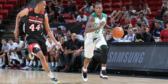 LAS VEGAS, NV - JULY 16: Terry Rozier #12 of the Boston Celtics drives to the basket against the Portland Trail Blazers during the game on July 16, 2015 at Thomas And Mack Center, Las Vegas, Nevada. NOTE TO USER: User expressly acknowledges and agrees that, by downloading and or using this Photograph, user is consenting to the terms and conditions of the Getty Images License Agreement. Mandatory Copyright Notice: Copyright 2015 NBAE (Photo by Jack Arent/NBAE via Getty Images)